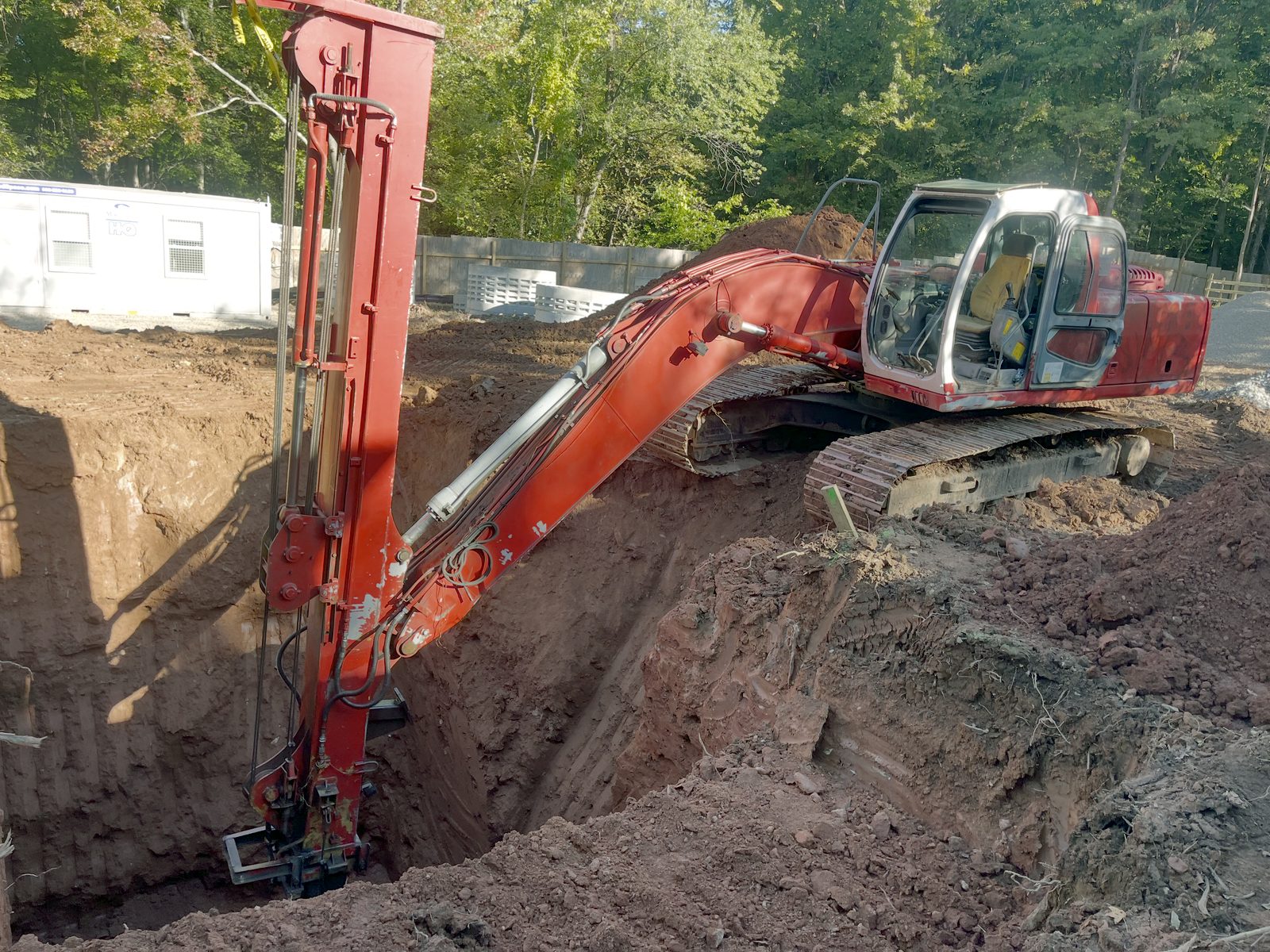 Reliable Site Development long reach excavator digging a deep excavation